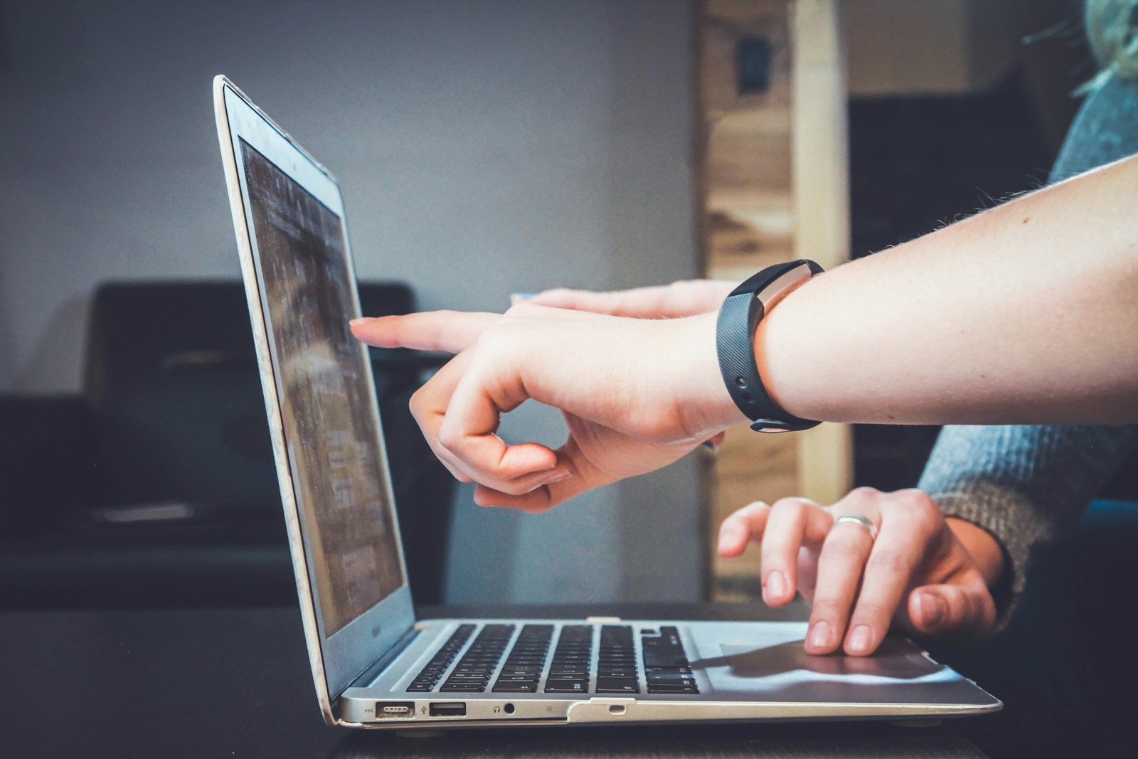 Person browsing a website on a laptop